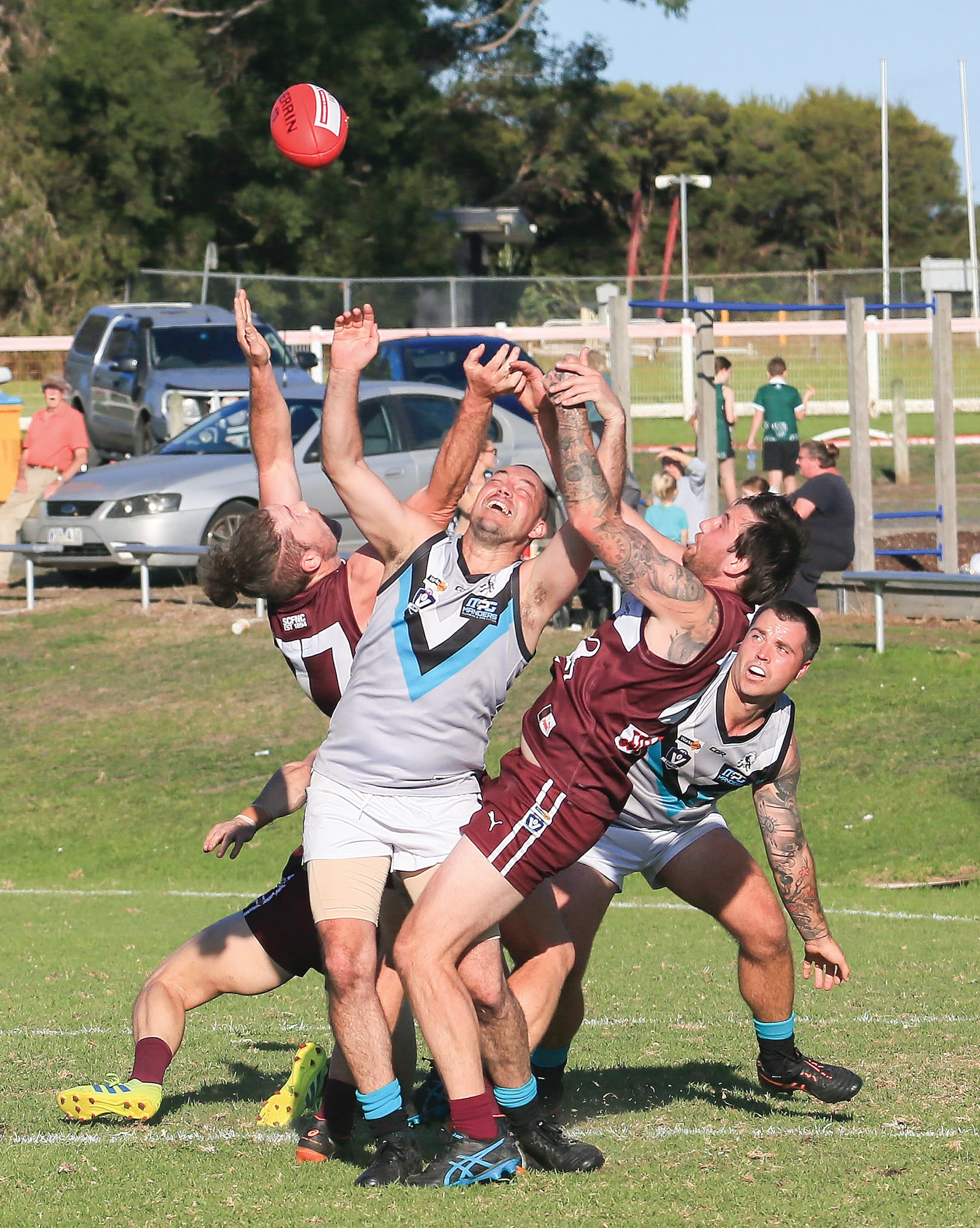 Jack Stuart, Will Cashin and Jake Smart contest the ball. Photo: G. S. Bruning.