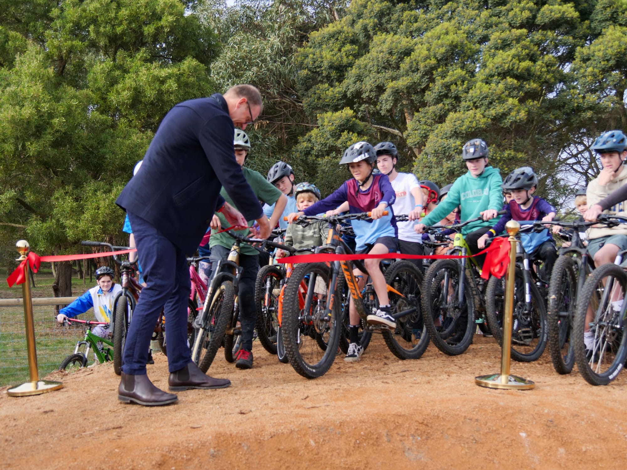 Drew Ginn OAM was honoured to cut the ribbon at the official opening of the Newhaven College Mountain Biking pump track, with students champing at the bit to get going.