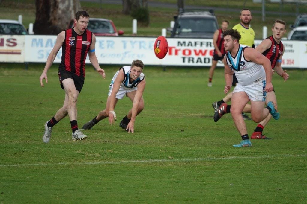 Tyson Andrighetto has eyes only for the ball in fiercely contest reserves' match between Wonthaggi Power and Maffra at Maffra on Saturday.