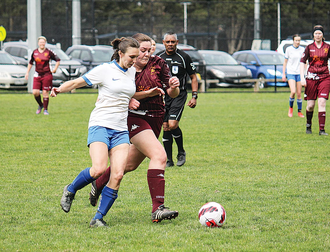 LKFC’s Naomi Eaton challenges her opponent for the ball.
