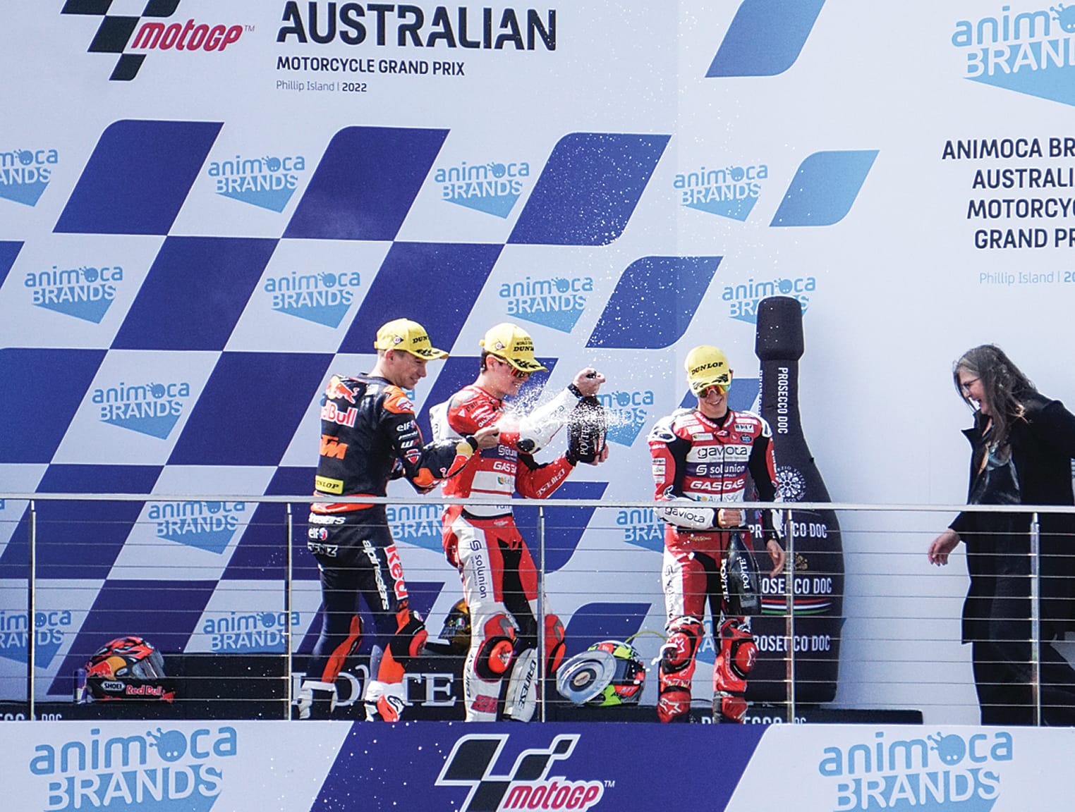 Izan Guevara is seen celebrating after taking out Moto3 World Championship with Deniz Öncü (second place) and Sergio Garcia (third place).