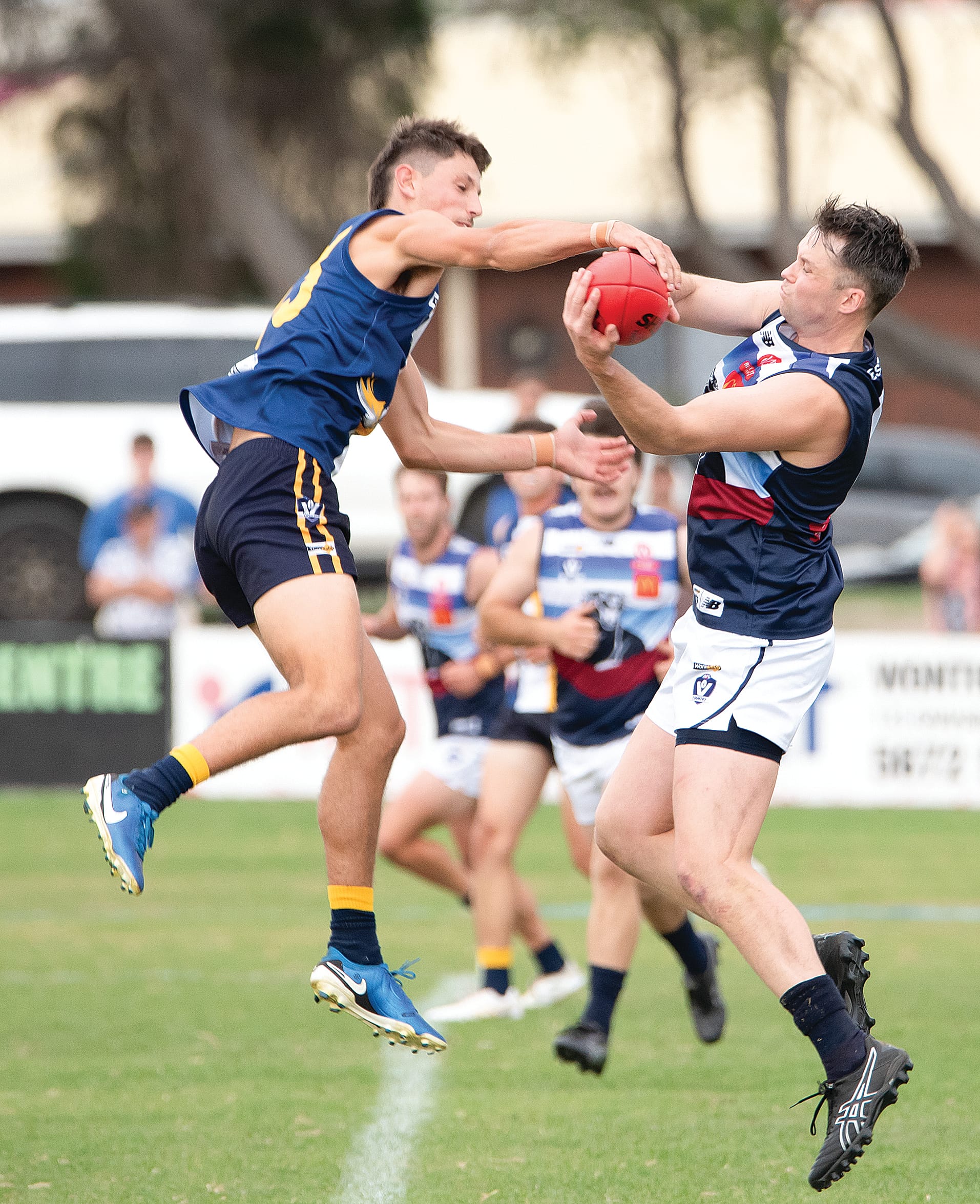 Timothy Gunn (Kilcunda Bass) marks despite the efforts of IK’s Jordan Bertacco. Photos: Anna Carson