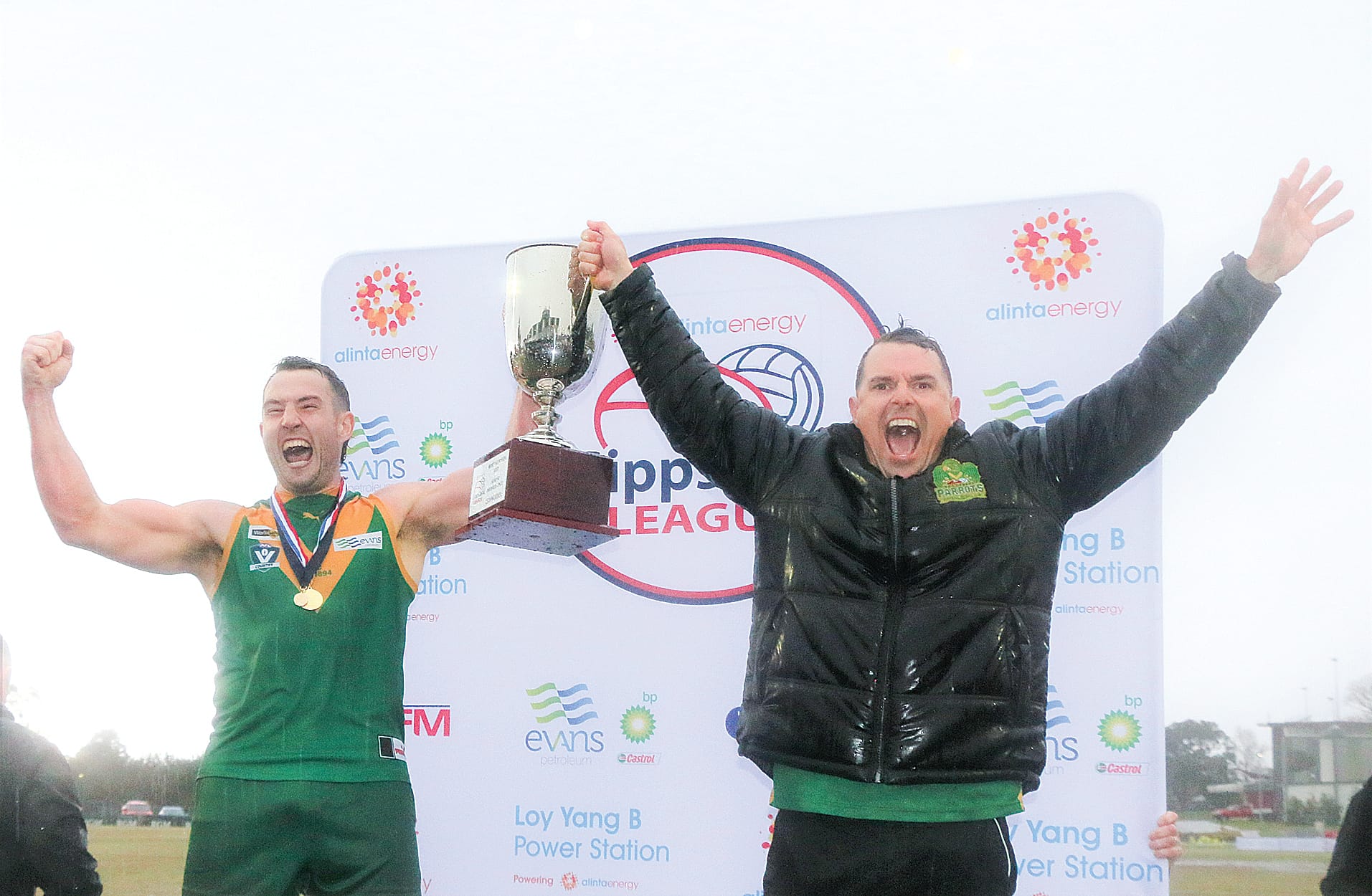 Leongatha Parrot’s premiership captain Tom Marriott and coach Trent McMicking raise the 2022 Gippsland League Premiership Cup after an epic battle at Moe on Saturday.