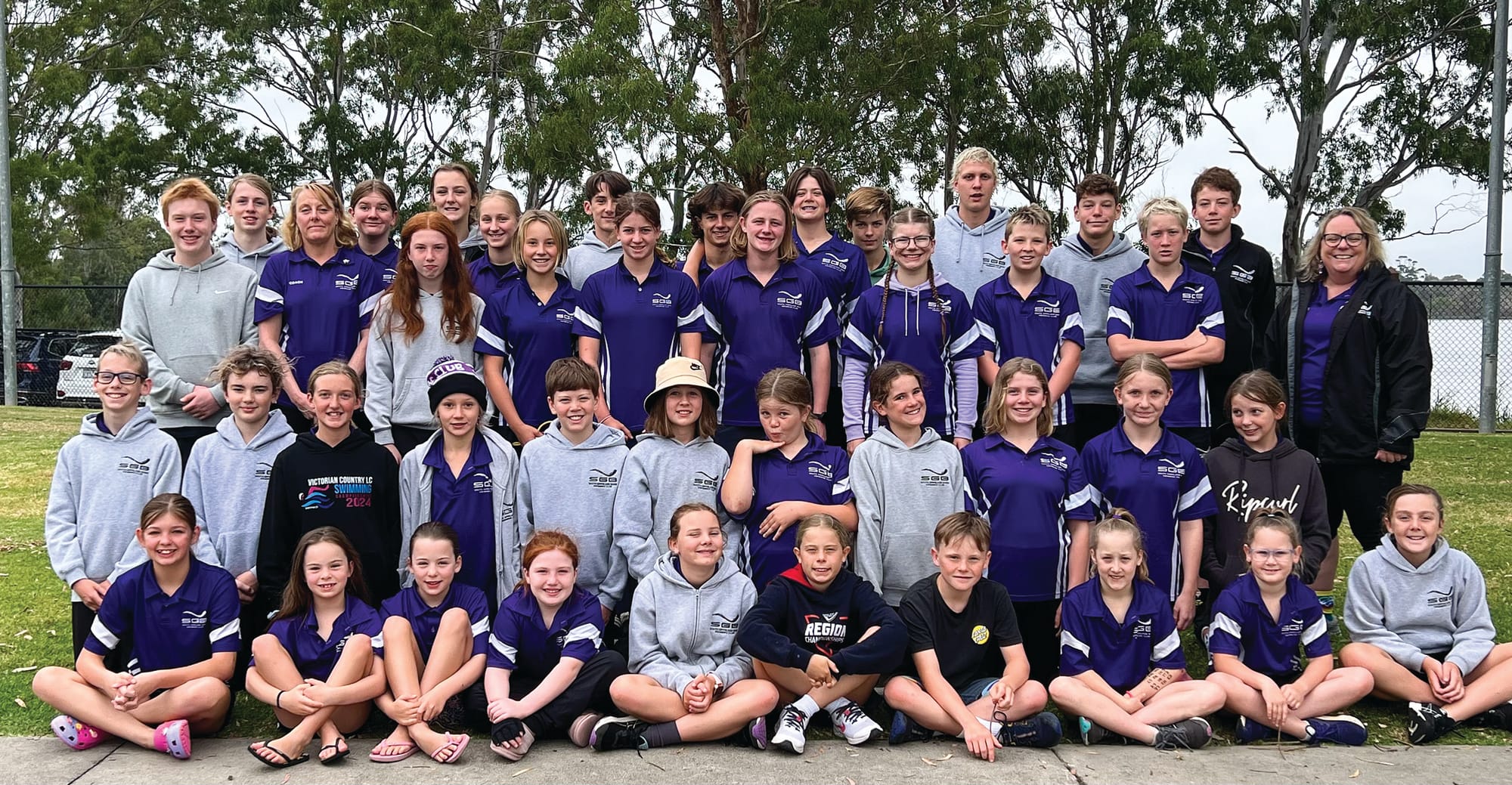 Pre-racing smiles with South Gippsland Bass swimming coaches Lorri and Sam.
