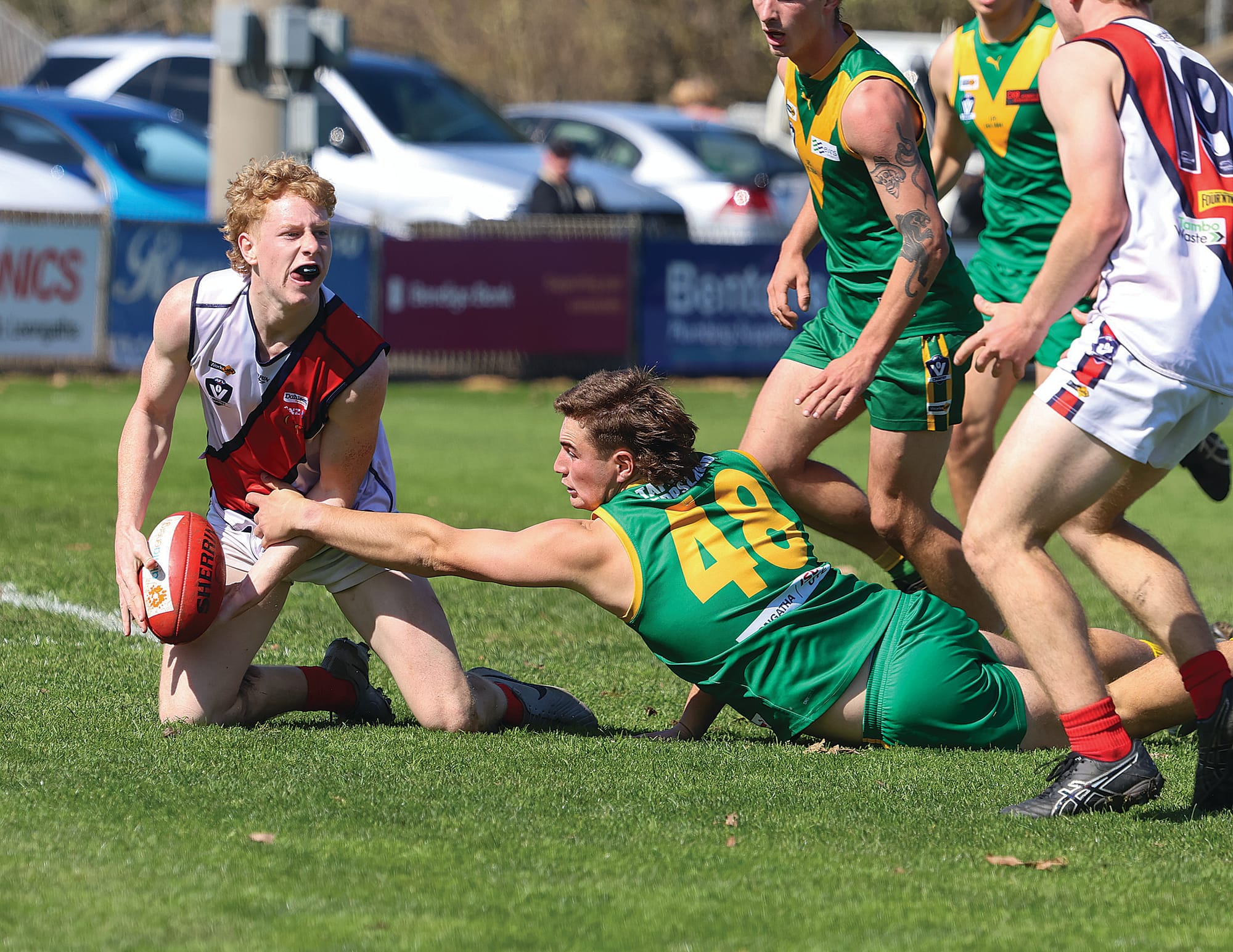 Leongatha defender Kyle Brown lunges at the ball to stop the progress of one of Bairnsdale’s danger forwards Logan Dunkley in Saturday’s reserves semi-final.
