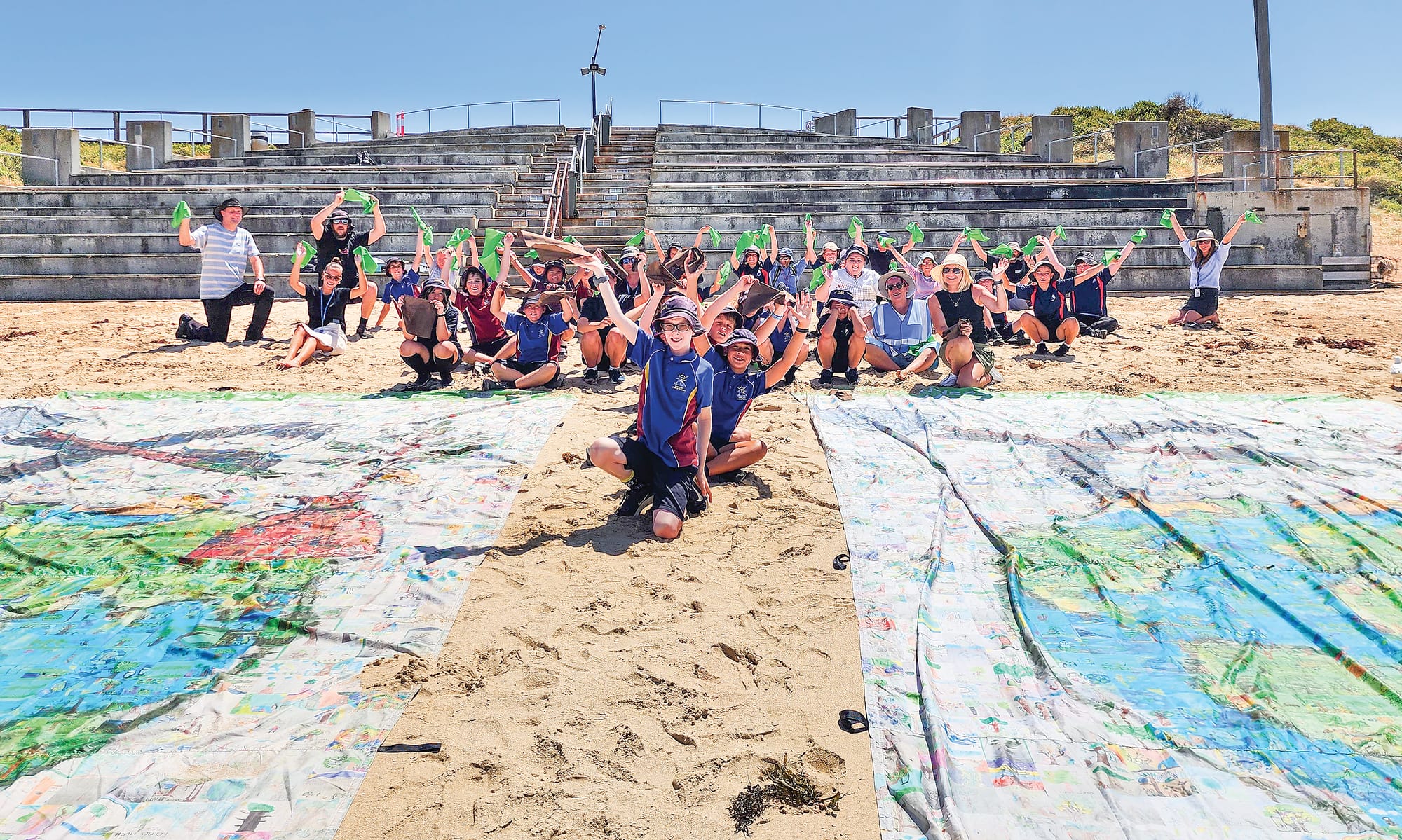 Alongside creating an SOS from the sky, students also posed with green and brown cloth in the form of a tree in a bid to raise awareness.