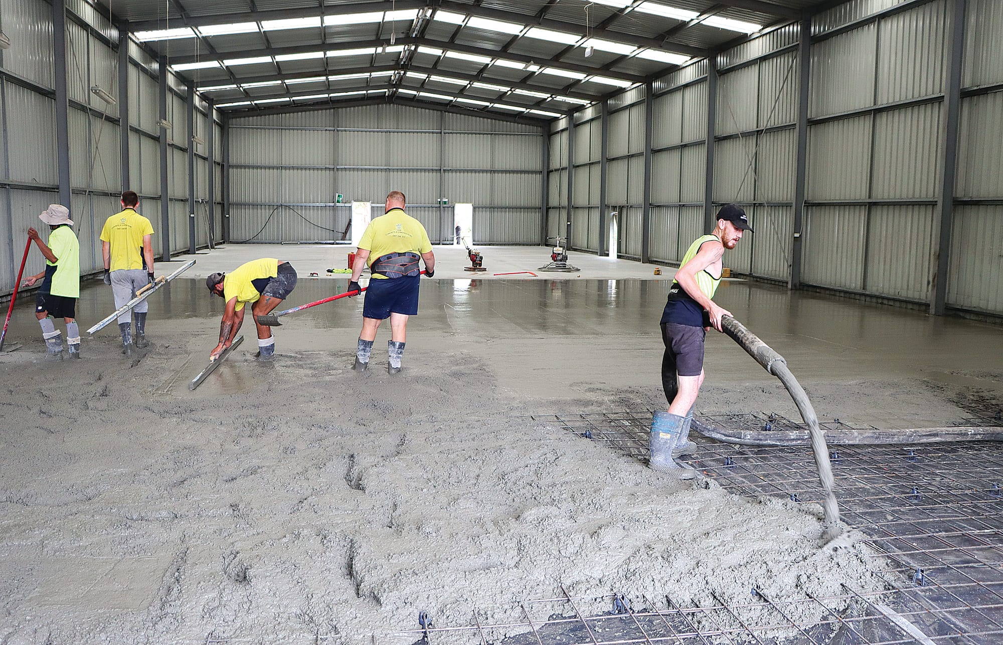 Concrete pouring and levelling take place on Saturday in the new Korumburra Men’s Shed.

