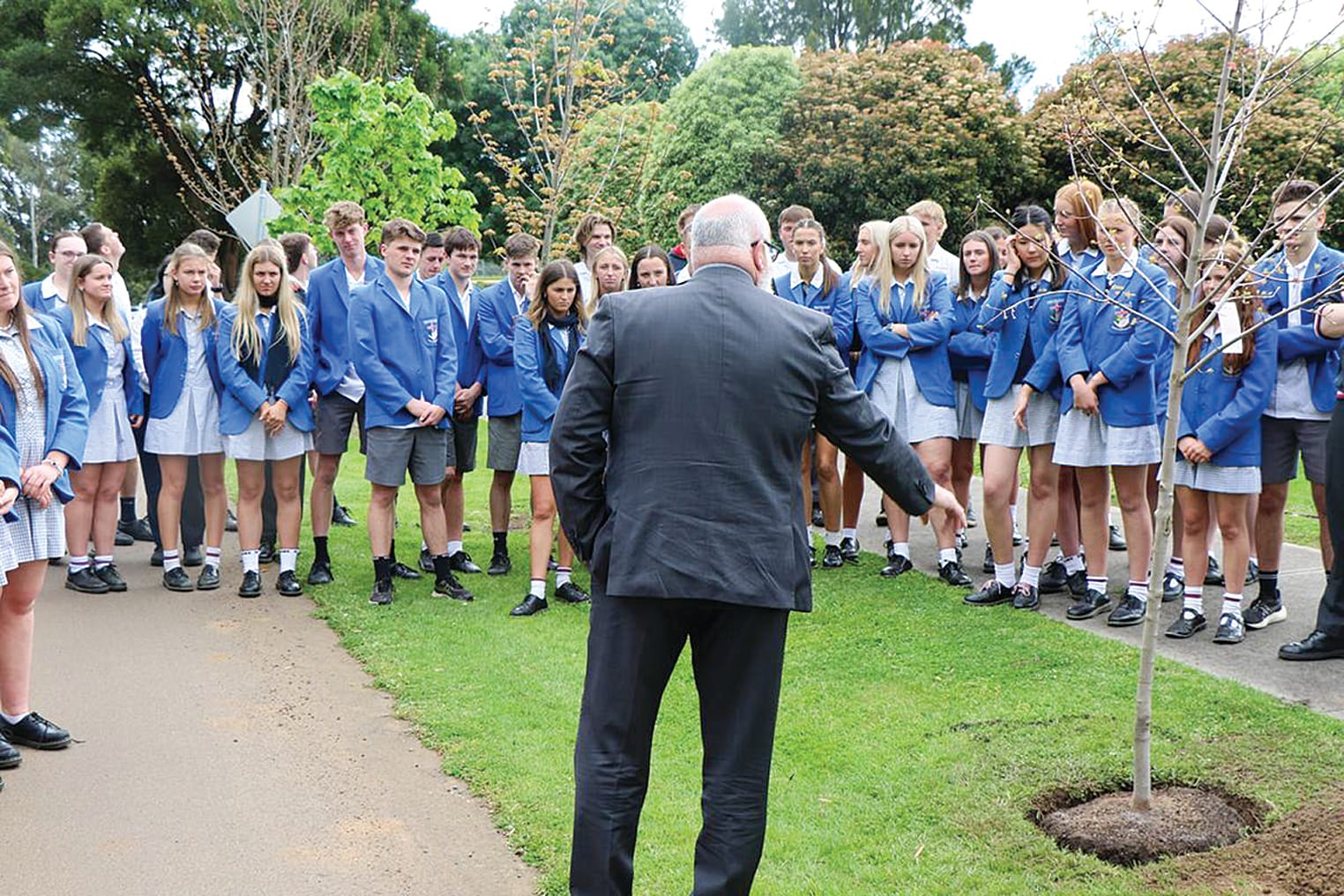Mary MacKillop Year 12 students gather around the Graduation Tree.