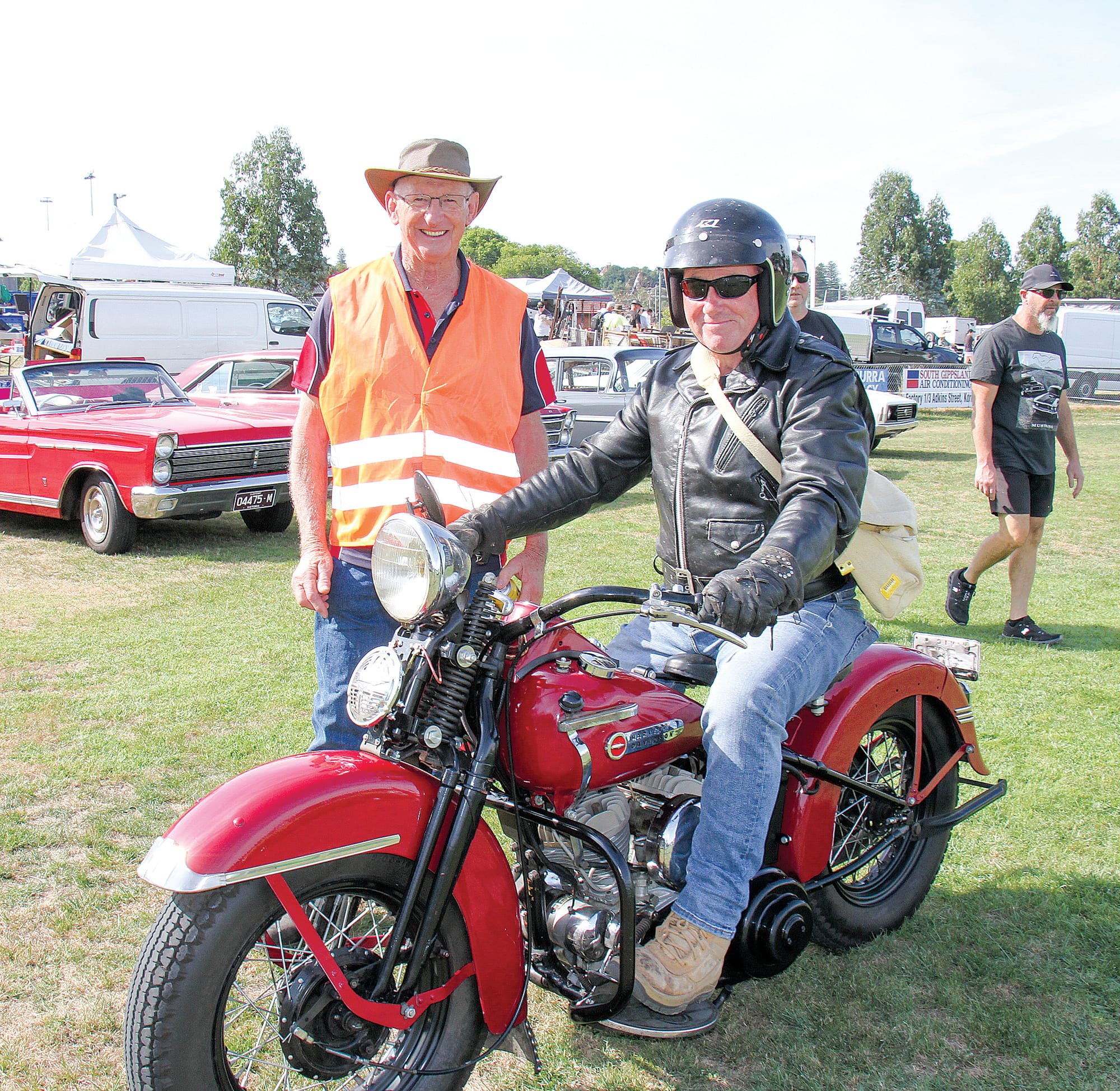 Korumburra Swap Meet volunteer Bernie Watt with Ray from Wonthaggi and a 1950 Harley. B156_0225