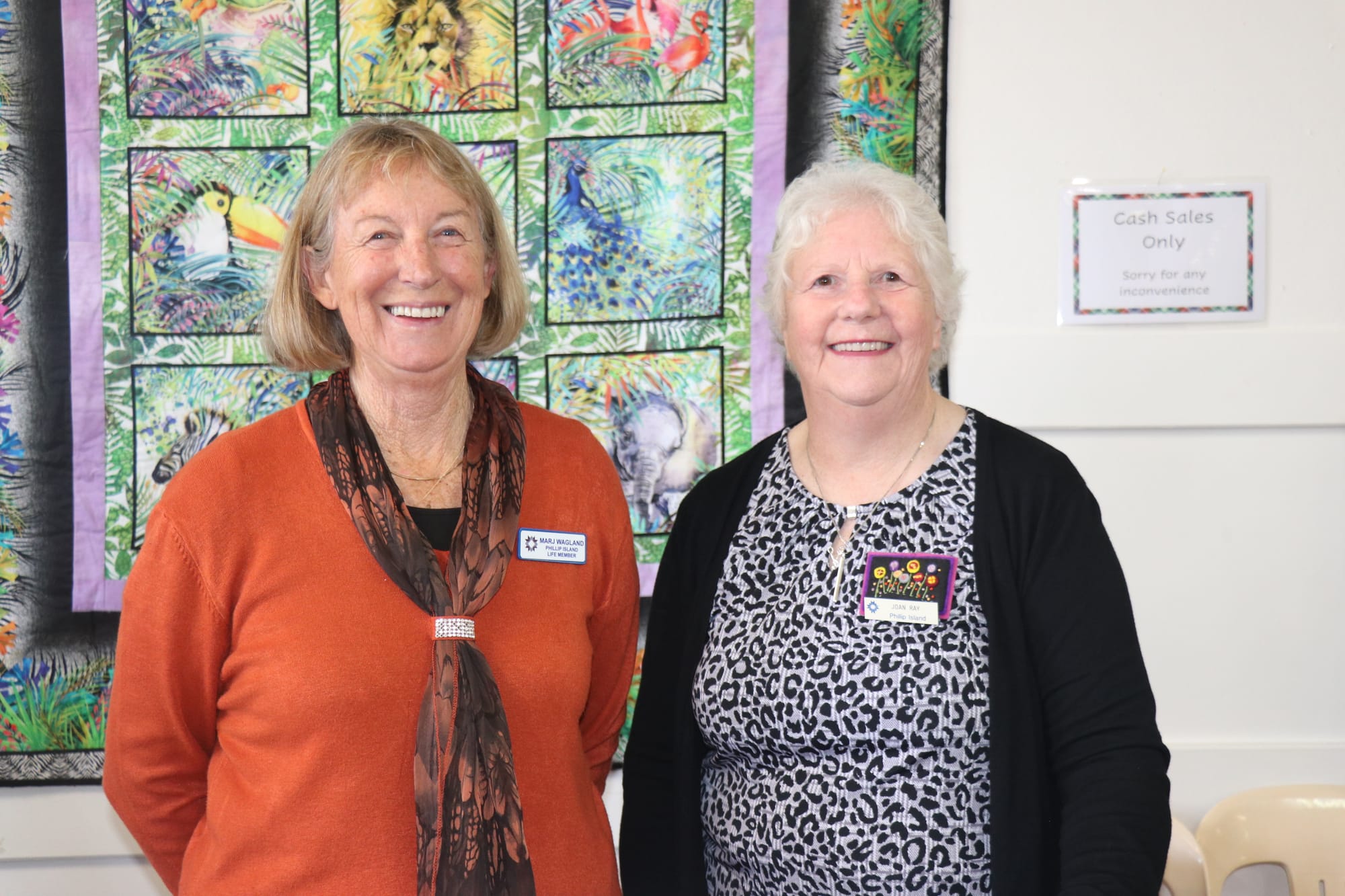 Marj Wagland and Joan Ray volunteering at the patchwork display in Newhaven selling fabrics and books at the trading table. 