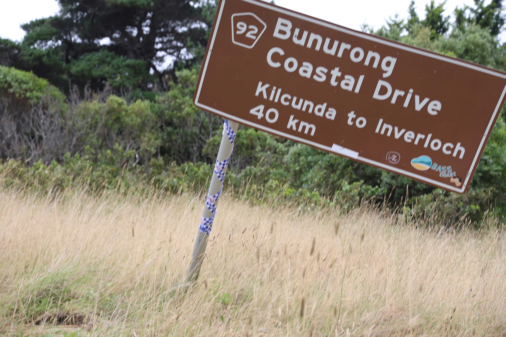 The road sign the vehicle collided with hangs precariously on one footing after last nights accident.