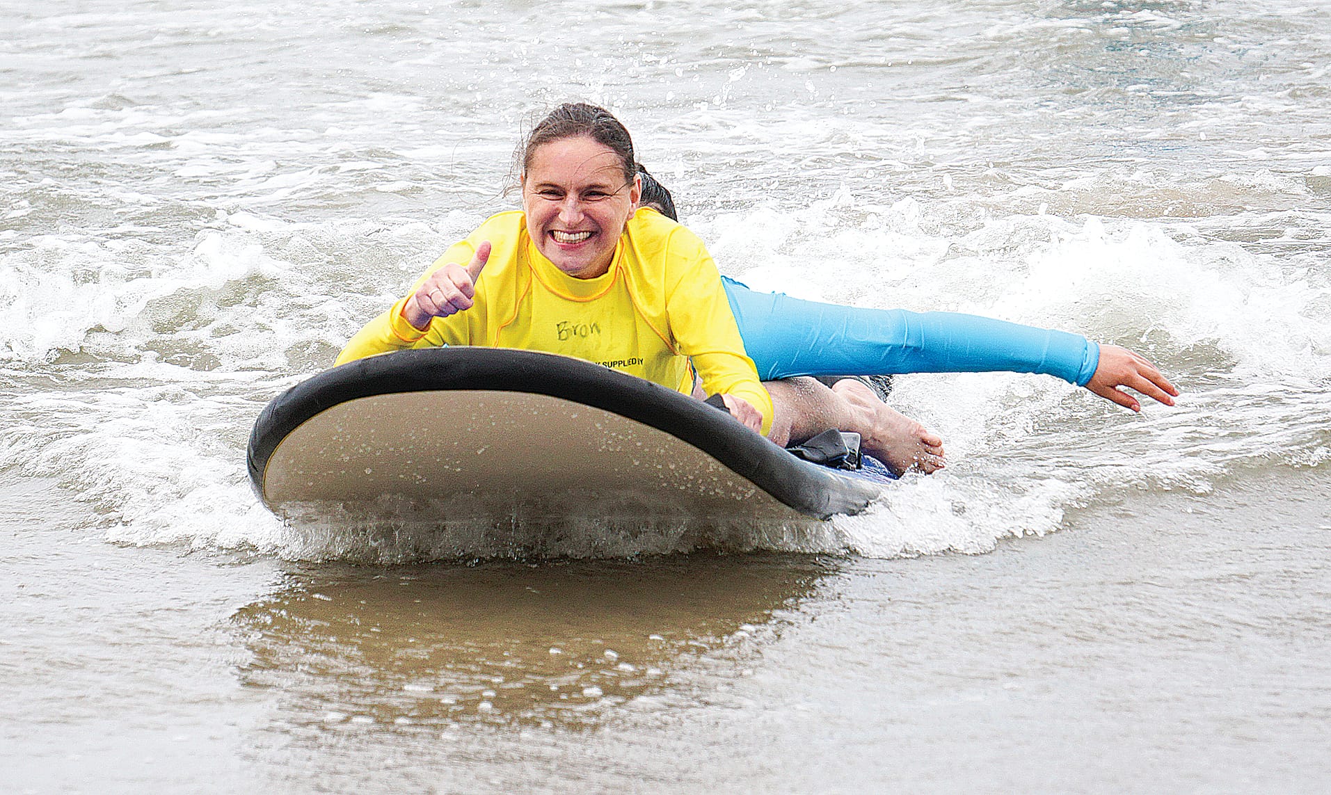 The joy was visible on Bron’s face as volunteers guided her through the waves. Ns39_0424