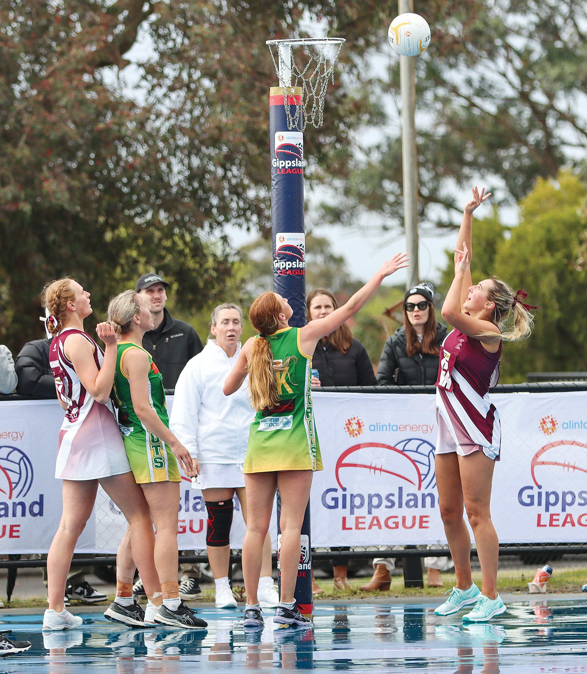 Alicia Marshman tries to impede her Traralgon opponent’s shot.