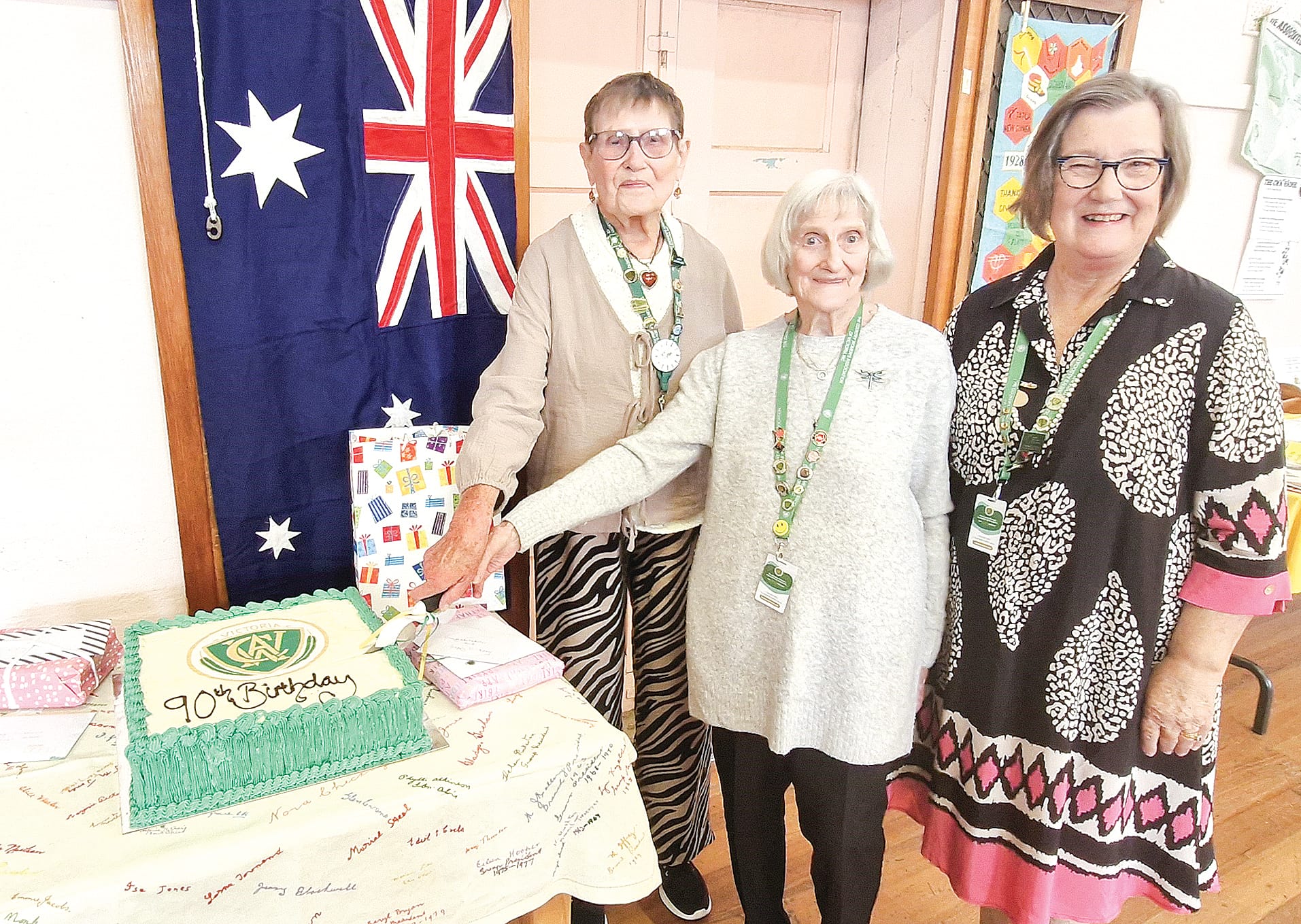 Dianne Holtrop and Jan Setford assisted in cutting the celebratory cake as the two longest serving members of Cowes CWA, pictured with president Lorraine Roy.