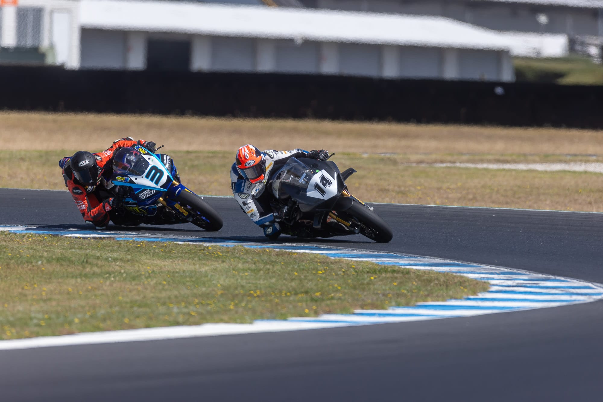 Aussie Superbike star Glenn Allerton leads Cameron Dunker through turn four on his way to victory.