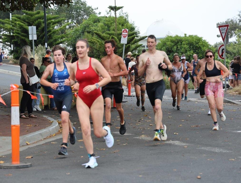 Some of the competitors head out on the 4km run following the 400 metre swim in the 2025 Cowes Classic Aquathon.
