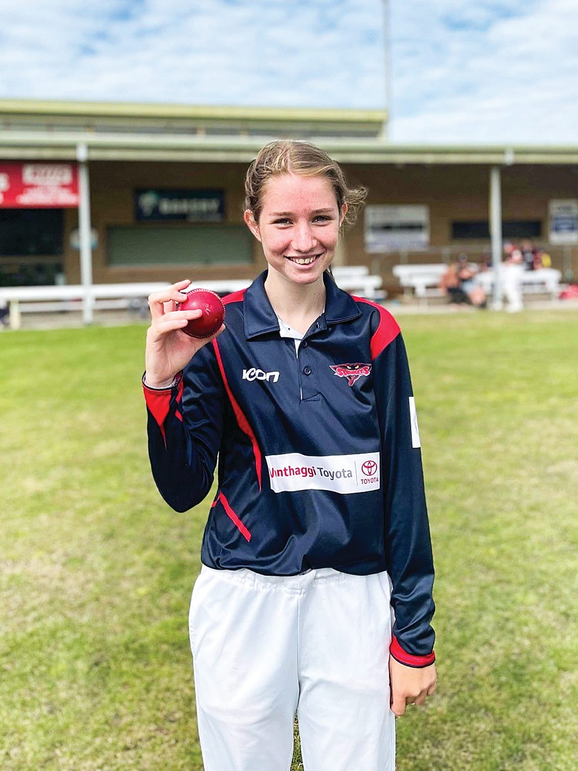 Young Stingray Holly Williams holds up the ball to celebrate her hat trick. 