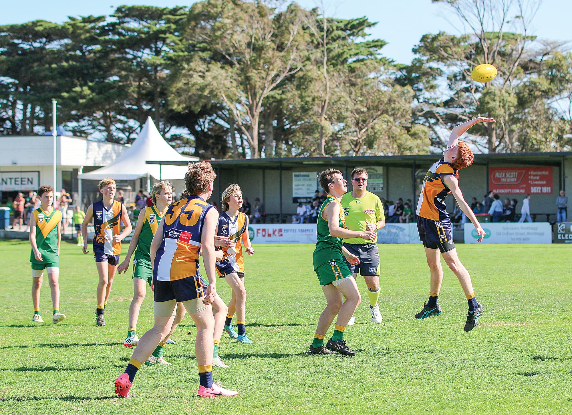 Inverloch-Kongwak’s William Bruce gets a hand to the ball in the U14 mixed grand final.