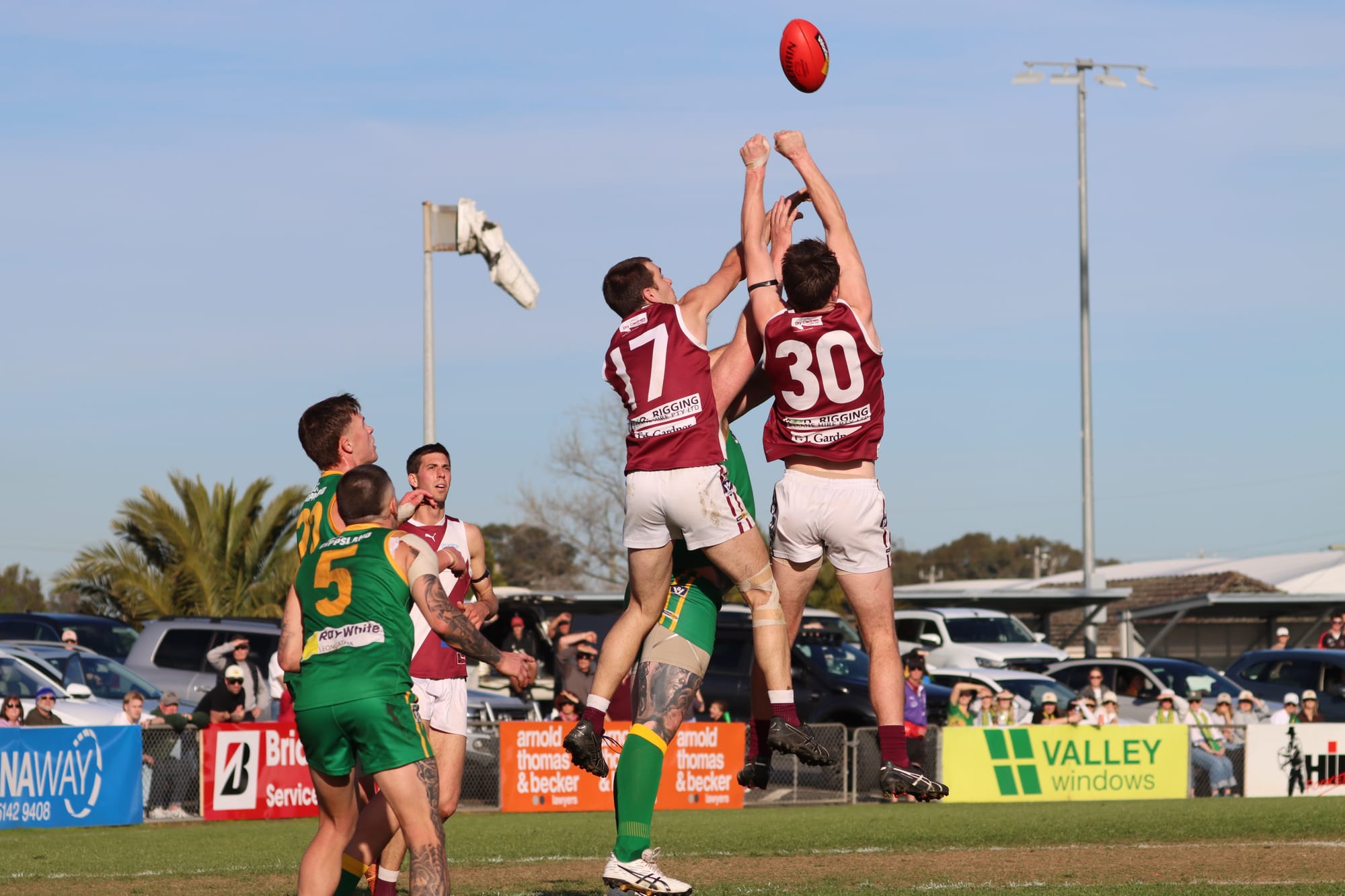 Strong performer Conor Little and skipper Tye Hourigan who was Traralgon’s best player, combine against Leongatha’s Ben Willis.