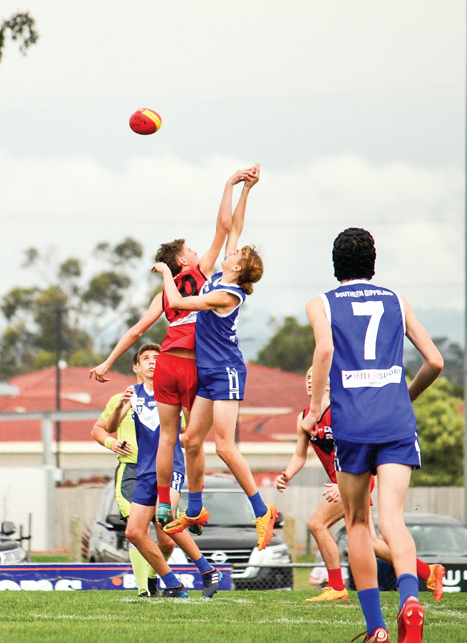 Jasper Shone goes up in the ruck for Southern Gippsland against his Western Gippsland opponent in the under 14s decider.