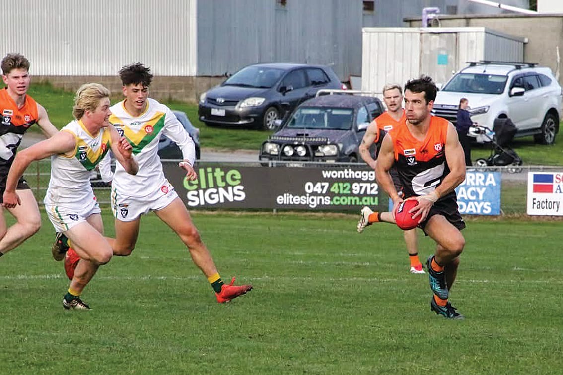 Jordan Ceppi looks to send the ball down the ground for Korumburra-Bena in the Seniors match against Garfield. 