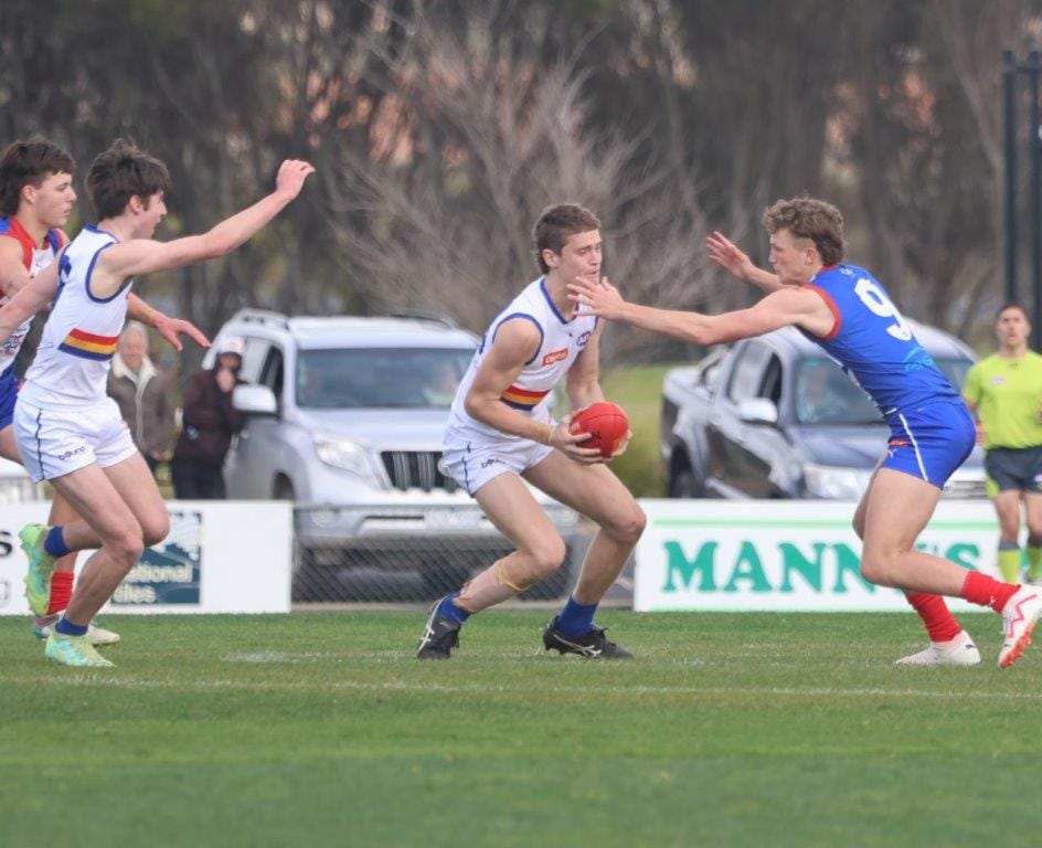 Zane Duursma stops his Eastern Rangers' opponent's progress.