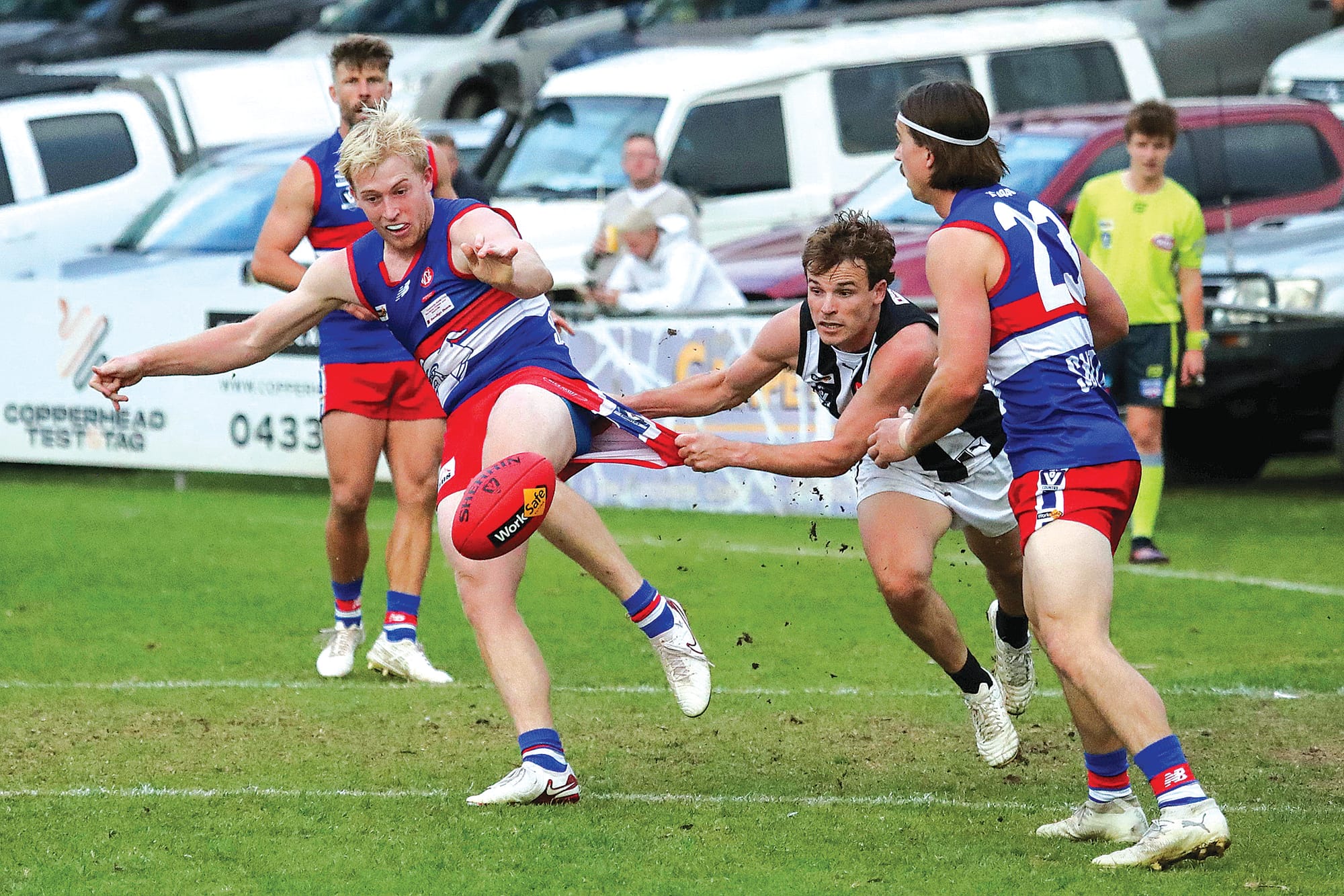 Hayden Bruce puts boot to ball under strong pressure from Dalyston’s Kyle Kirk. Photos: Carol Ratcliff.