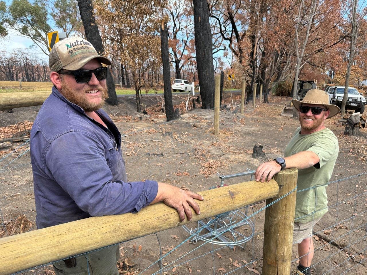 Fencing contractors Scott Dare and Scott Davidson of East Gippsland get to work replacing some of the fencing lost in The Gurdies bushfire.