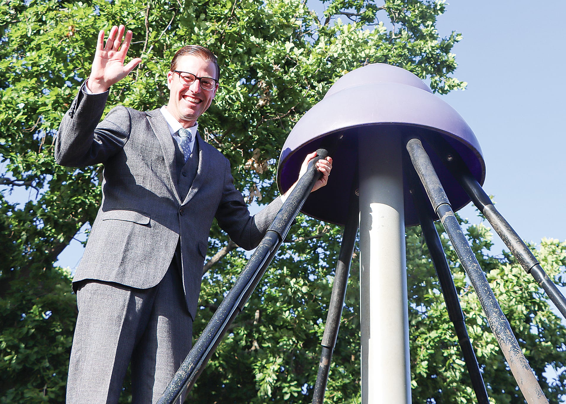 New principal Warwick Ford acquaints himself with the play equipment. A02_0525