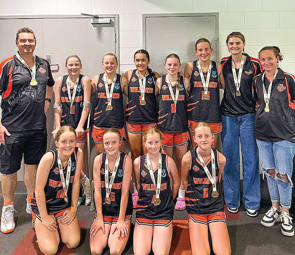 The Wildcat girls enjoy their Under 14 grand final success.