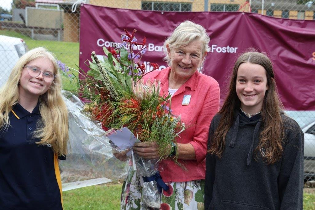 Fish Creek Primary School students Chloe Littlejohn and Addie Manne present award-winning local children’s author Alison Lester with some birthday flowers at the Fishy Stories Festival on Sunday.