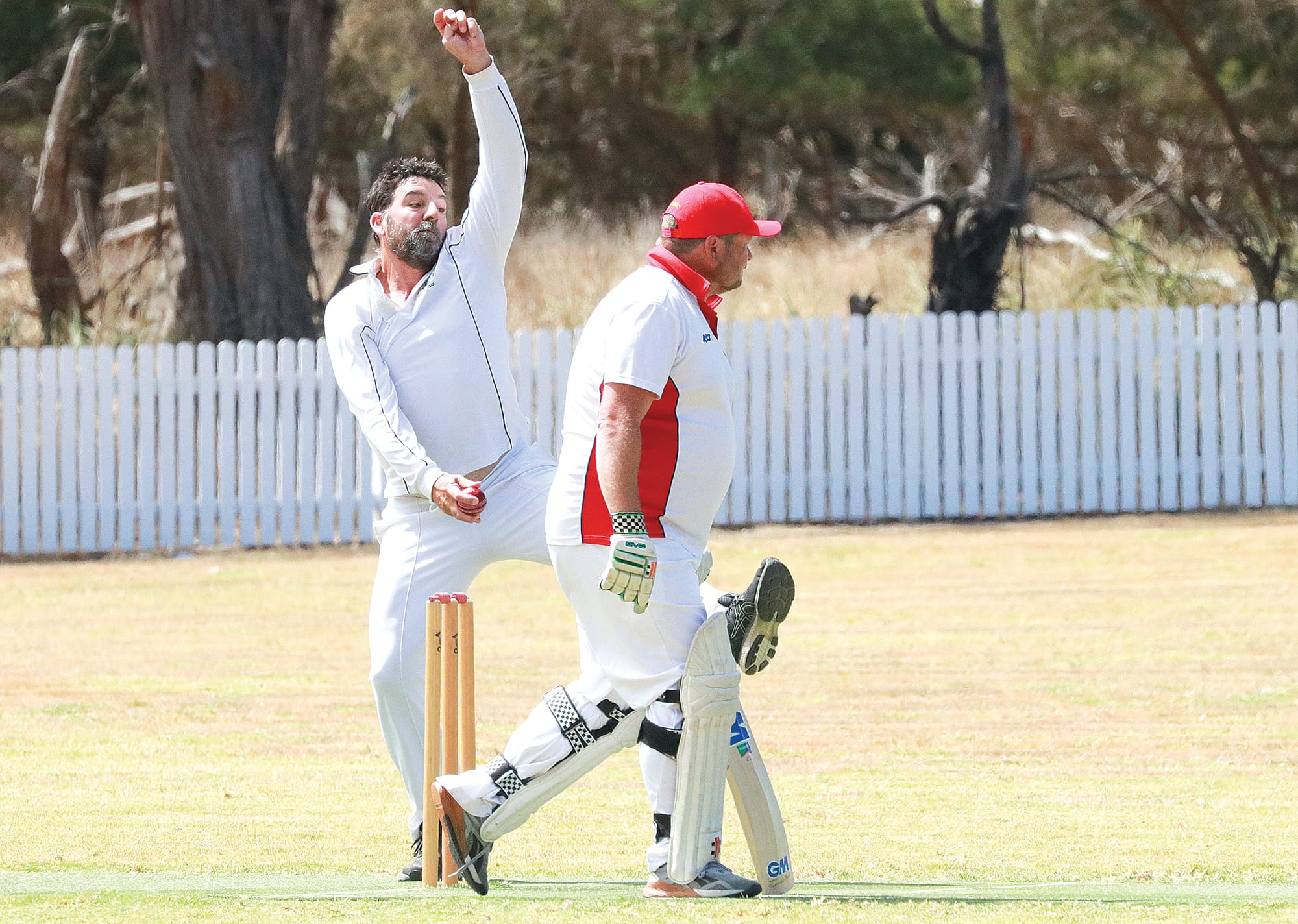 Peter Cleary bowls for Phillip Island against Glen Alvie, with batsman Ryan Luke. Z25_1024