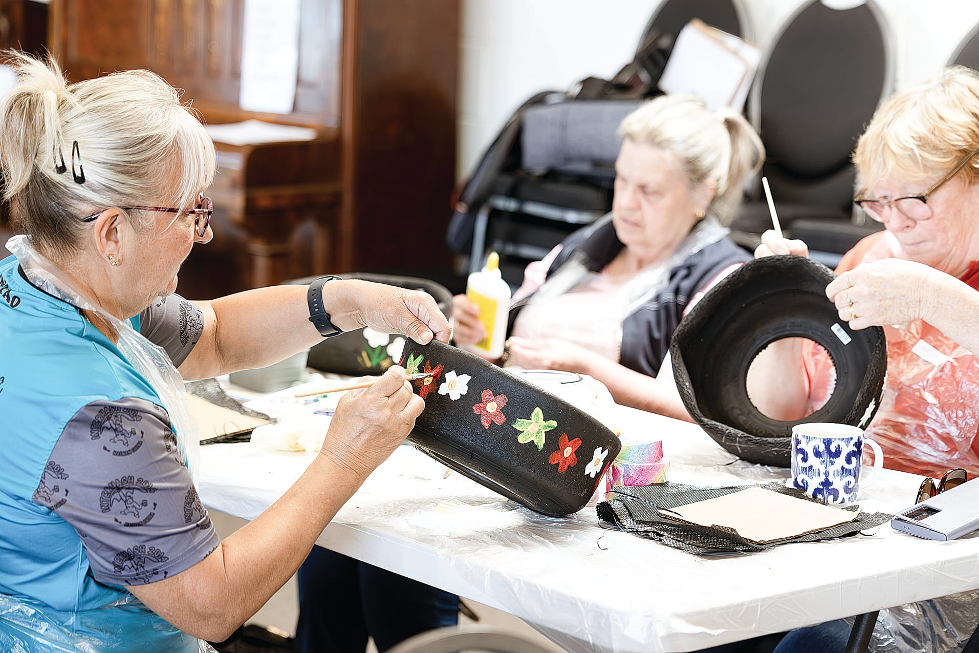 Attendees at the Corinella and District Community Centre had a tire-iffic time upcycling planters.