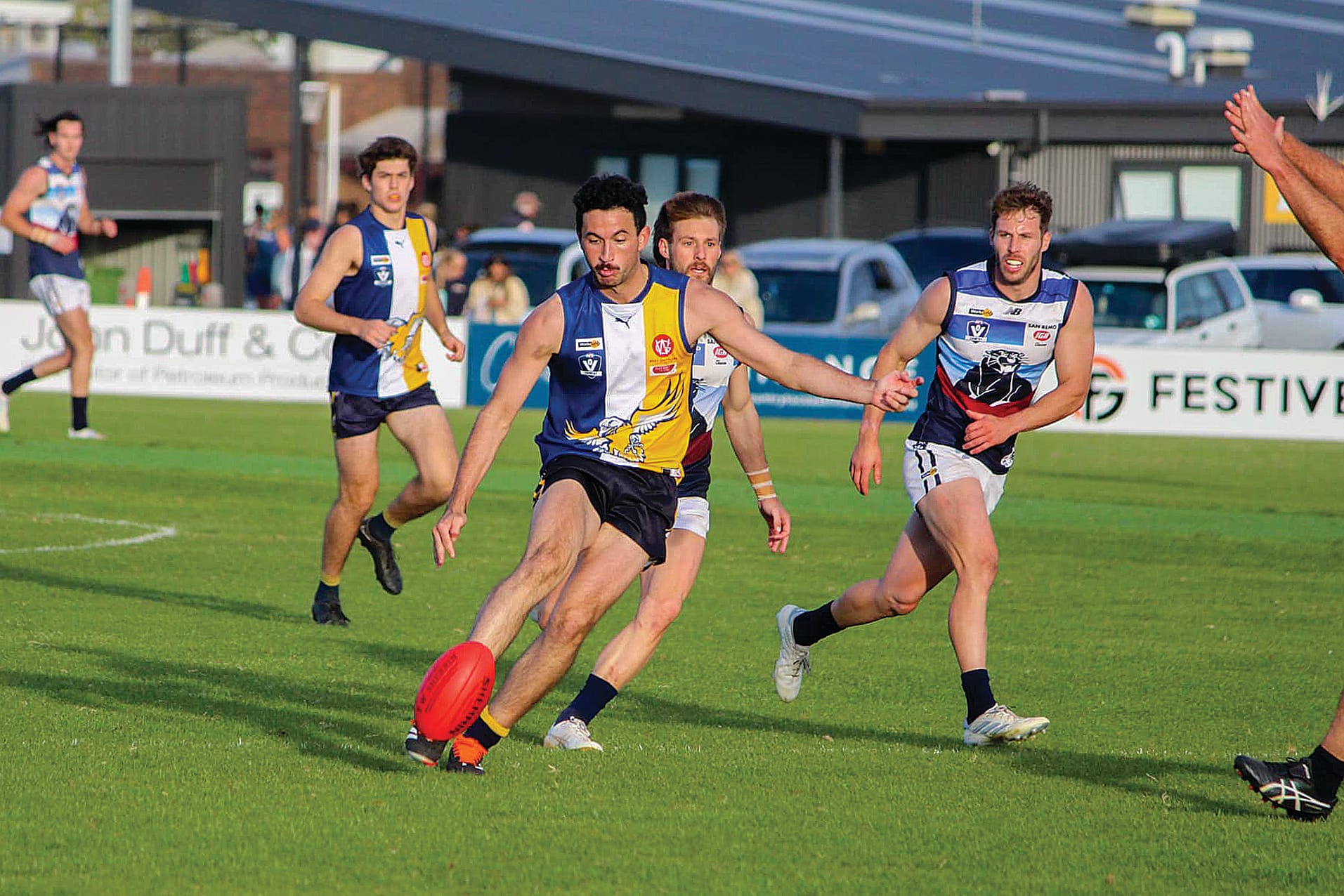 Marcus Toussaint delivers a pass into the forward line. Photos: Inverloch-Kongwak Football Netball Club facebook page.