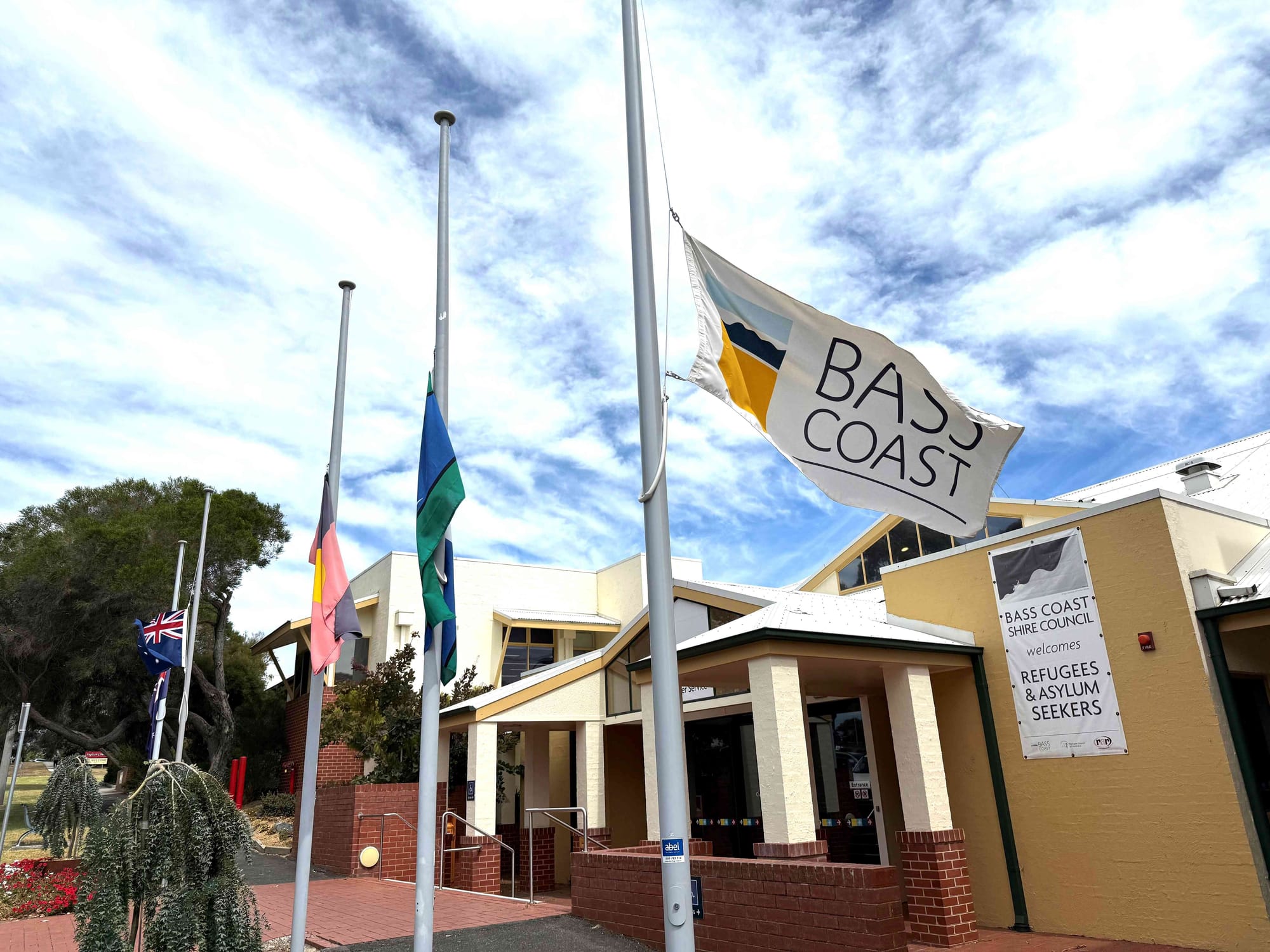 The flags outside the Bass Coast Shire Council offices in Wonthaggi, and at the Glen Alvie Community Centre were flown at half mast last Wednesday, February 26 during the commemorative service for former four-time mayor Neville Goodwin.