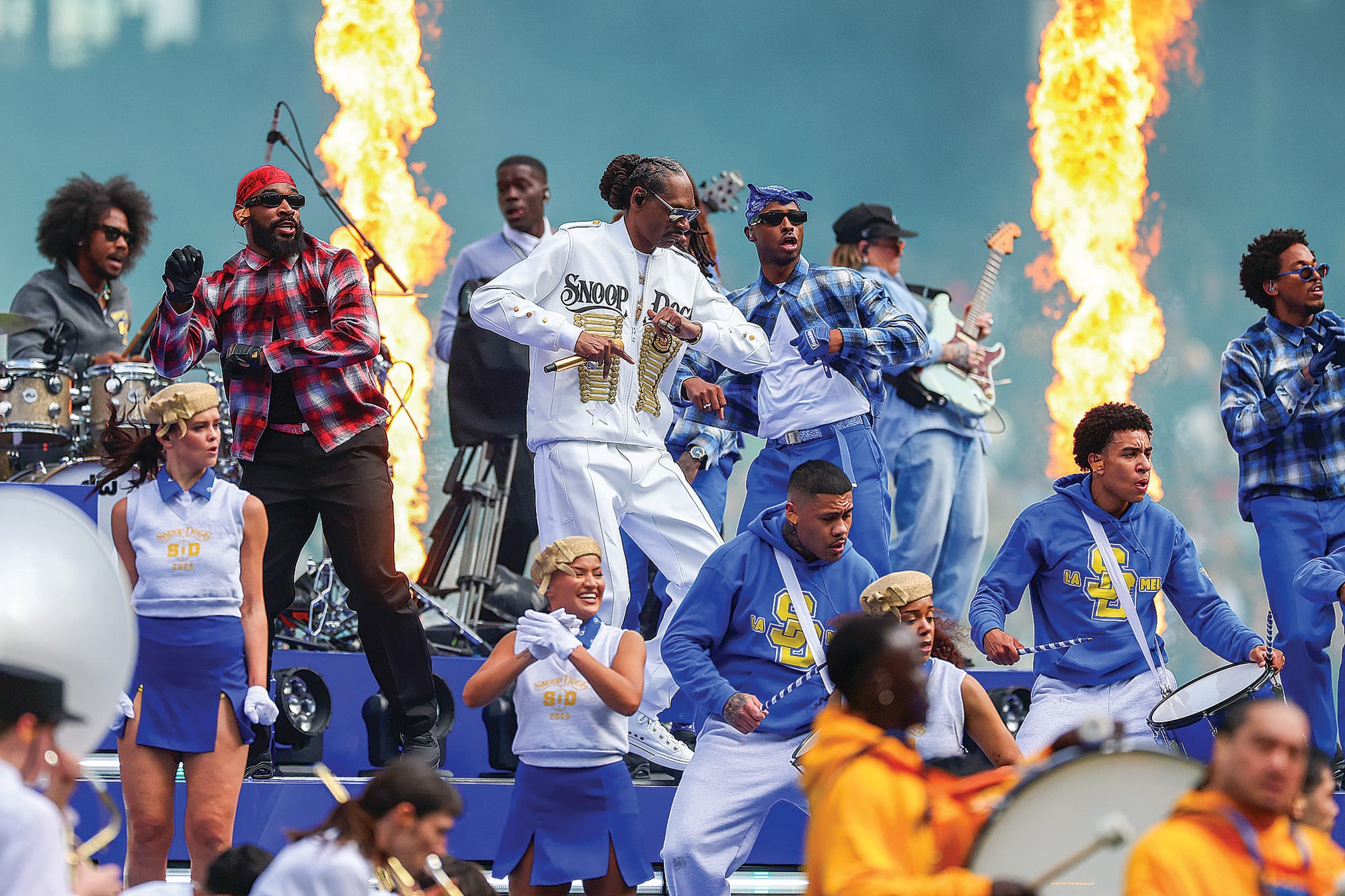 Marni McGrath on stage at the MCG with Snoop Dogg for the AFL Grand Final Day entertainment.