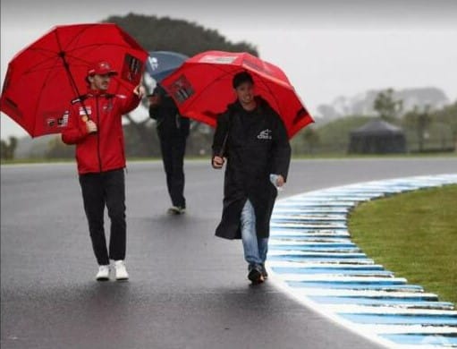 The clouds have cleared at the Island GP Circuit after a difficult day on Thursday, ready for the main racing days on Saturday and Sunday. Francesco Bagnaia and Casey Stoner take a track walk during the rain on Thursday. (Photographer: Gold and Goose from Motorsport Images).