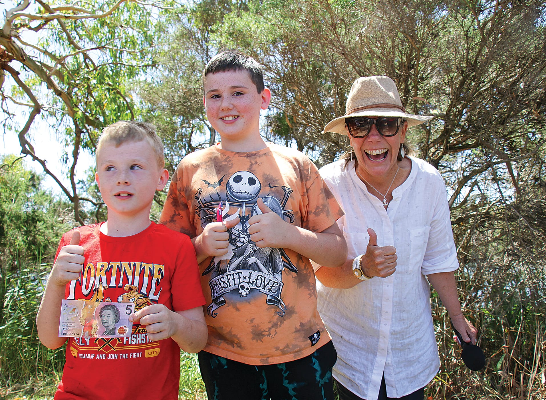 Duck derby winners Kayden and William with duck race-caller South Gippsland Deputy Mayor Cr Sarah Gilligan. B33_0425
