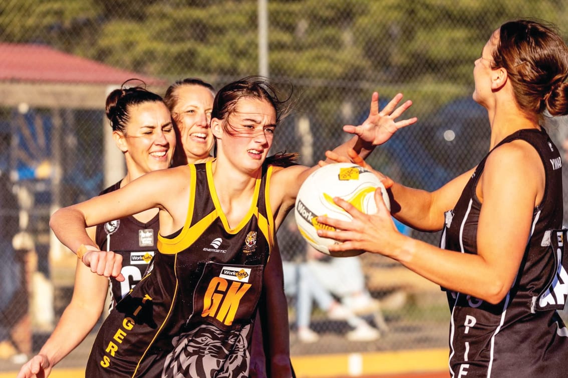 The Tigers’ Tyla Peters (A Grade) looks to intercept. 