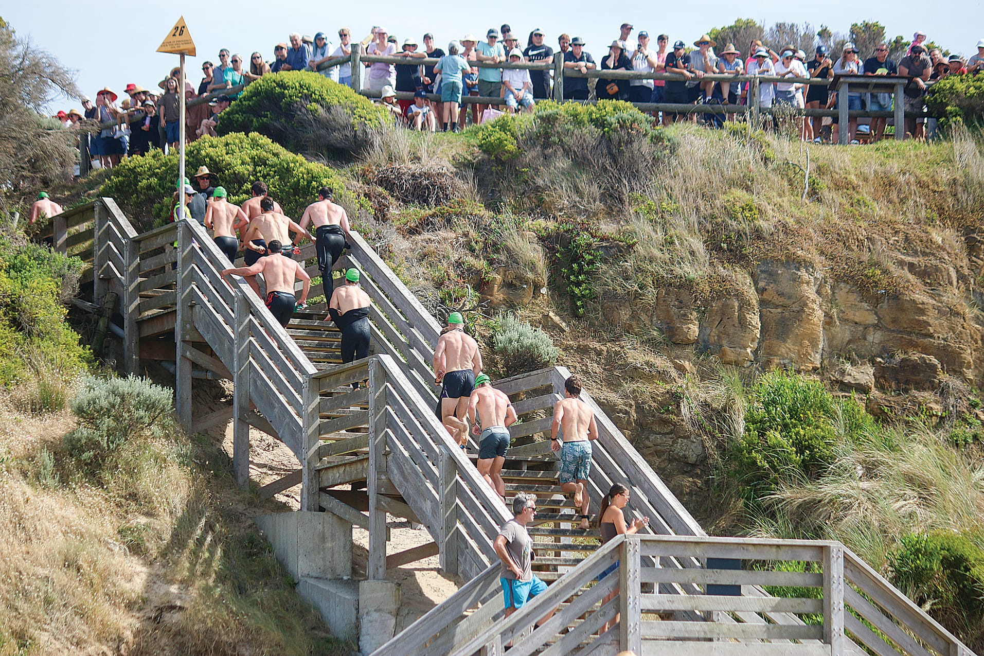 The swimmers head up the stairs to start the run leg of the race. ob42_0325