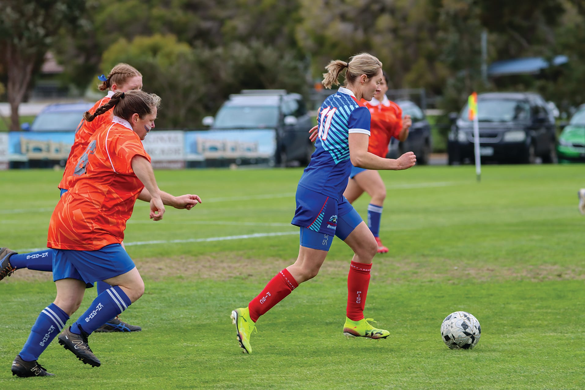 Phillip Island captain Kelly Wall tries to change course to catch Molly Gurnett of Leongatha. A64_3825