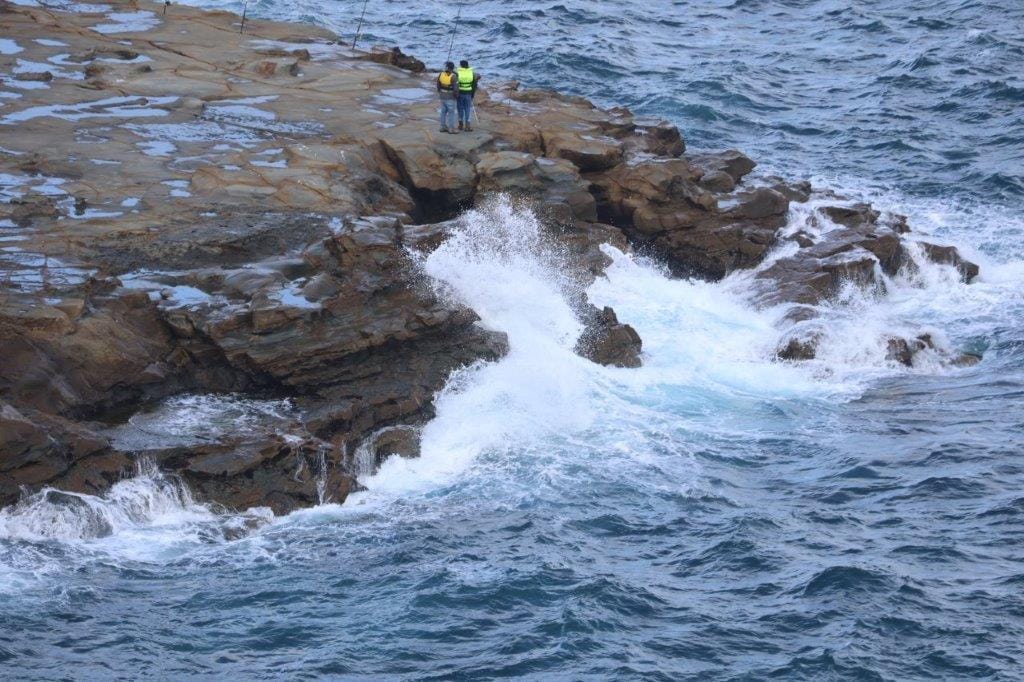 Several rogue waves which broke over the rocks at the Punch Bowl fishing platform on Friday morning are believed to have caused the tragedy.