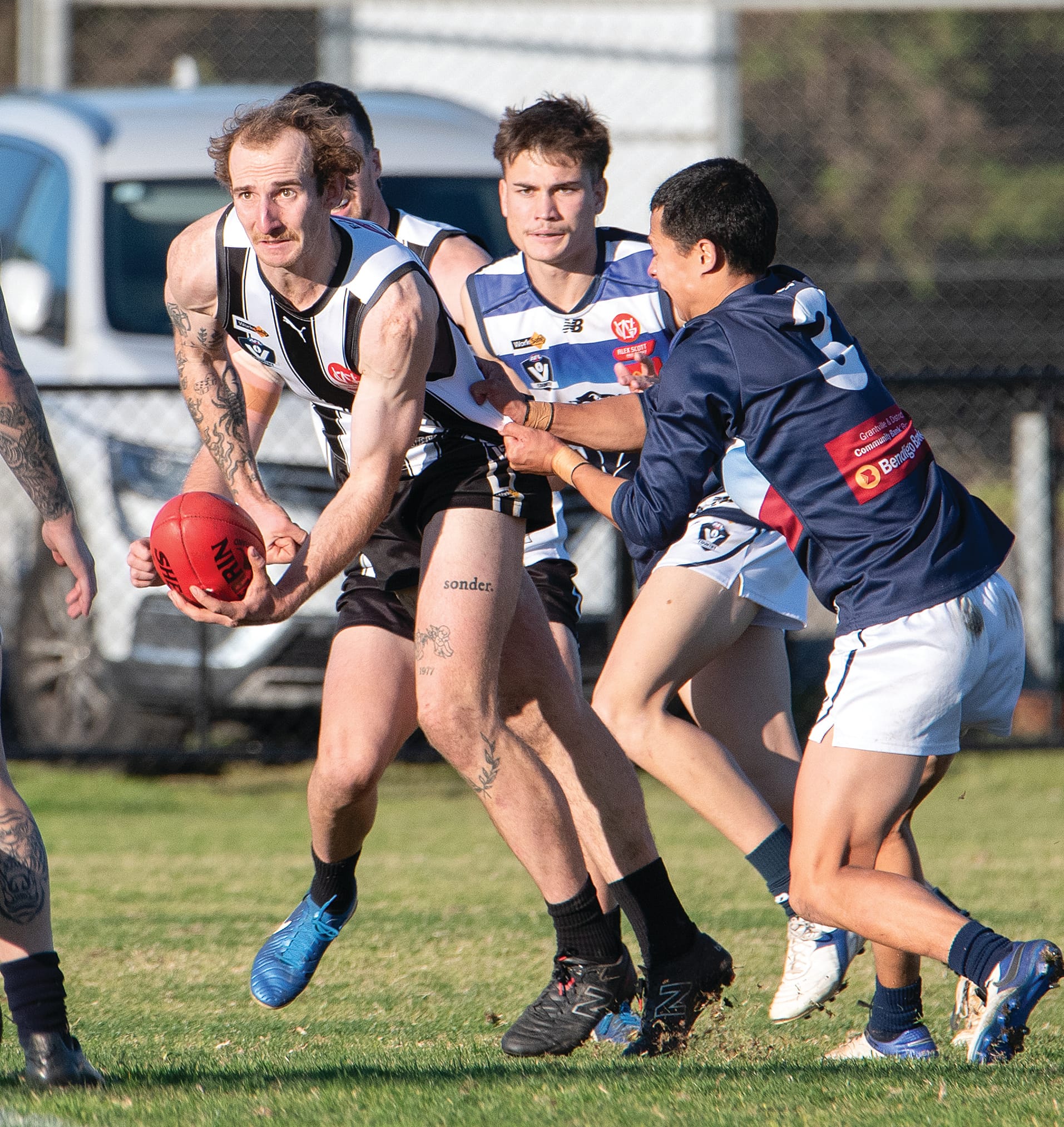 Louis Armstrong releases a handball despite pressure from Panthers’ Jed Rosenow. Photos Anna Carson.