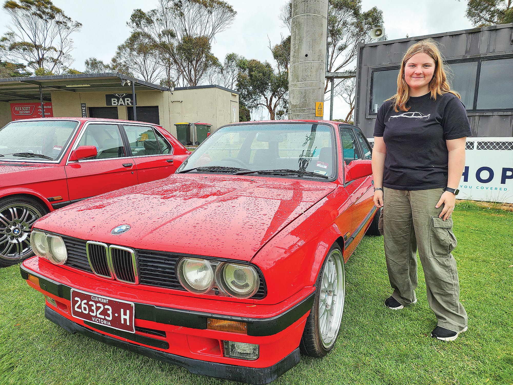 Grantville’s Olivia stands beside her mum’s BMW 318is E30 on Sunday, having left her identical green version at home. C21_4724