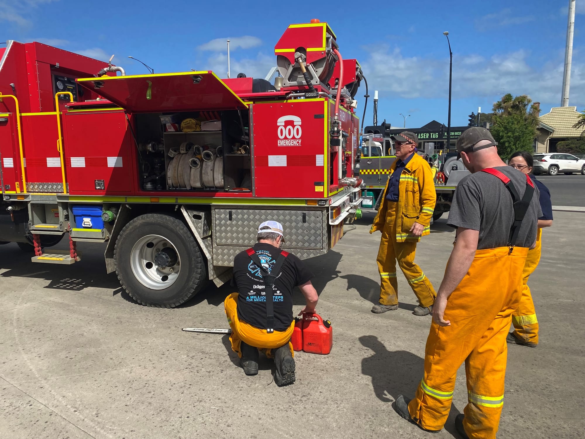 Strike team firefighters stock vehicles and tankers as they prepare to head to the Gippsland fires today.