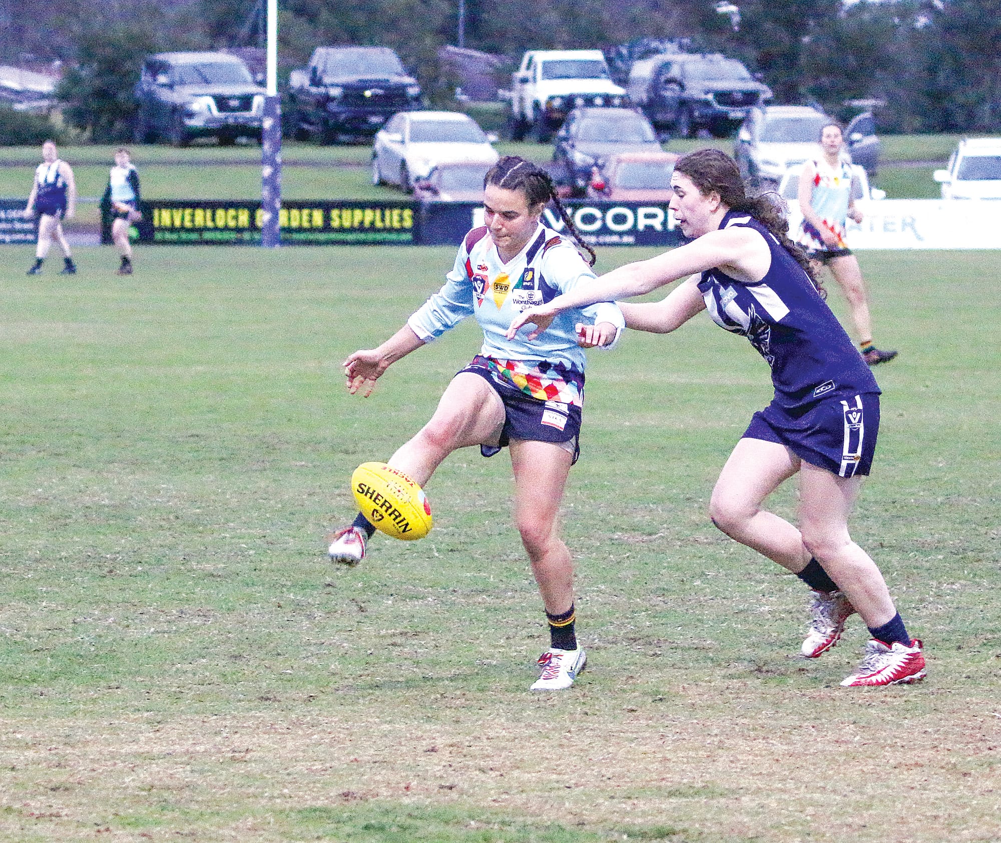 Jenna Russo for Breakers drop punts it down the field. ob22_2325