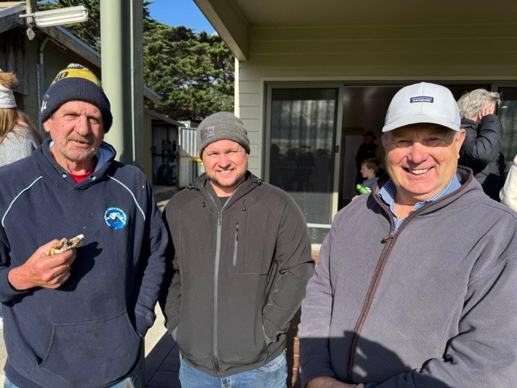 Jeff Walton and Paul Jeffrey chat with the organiser of the Farmers’ Picnic at the Ventnor Recreation Reserve on Sunday, Greg Price.