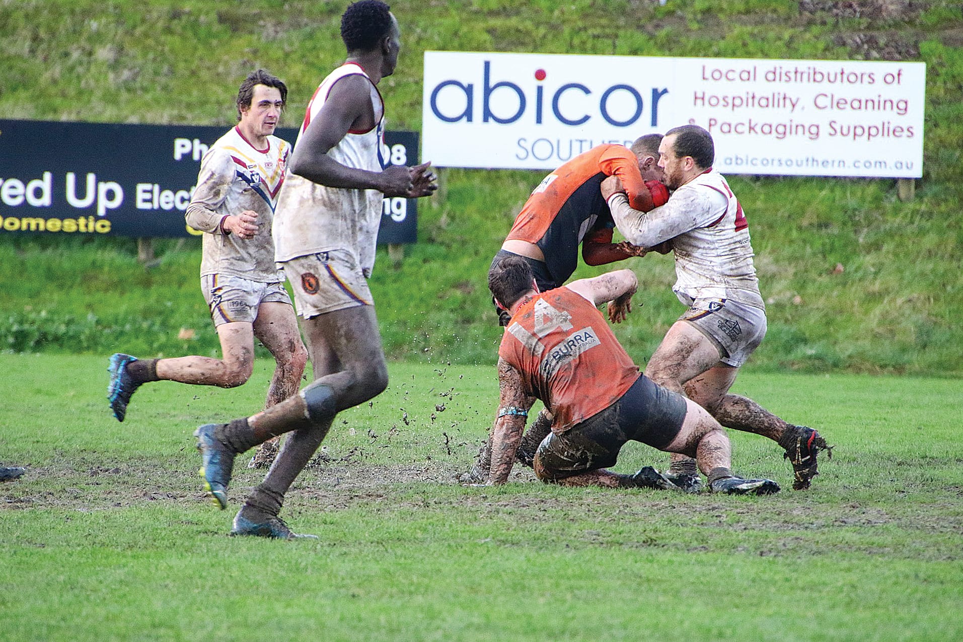 The Giants and Industrials battle it out in tough conditions at the Korumburra Showgrounds.