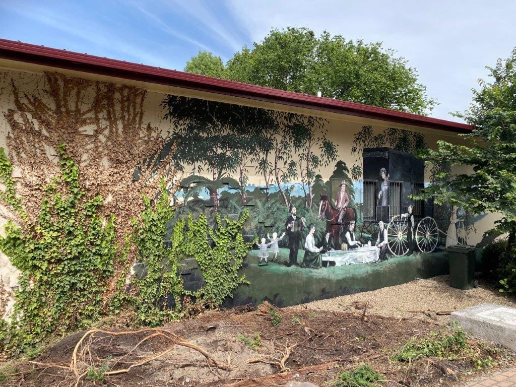 The hiostoric mural on the front of the old Korumburra Shire Offices is being digitally recorded for posterity and other artifacts have been presented to the Korumburra and District Historical Society.