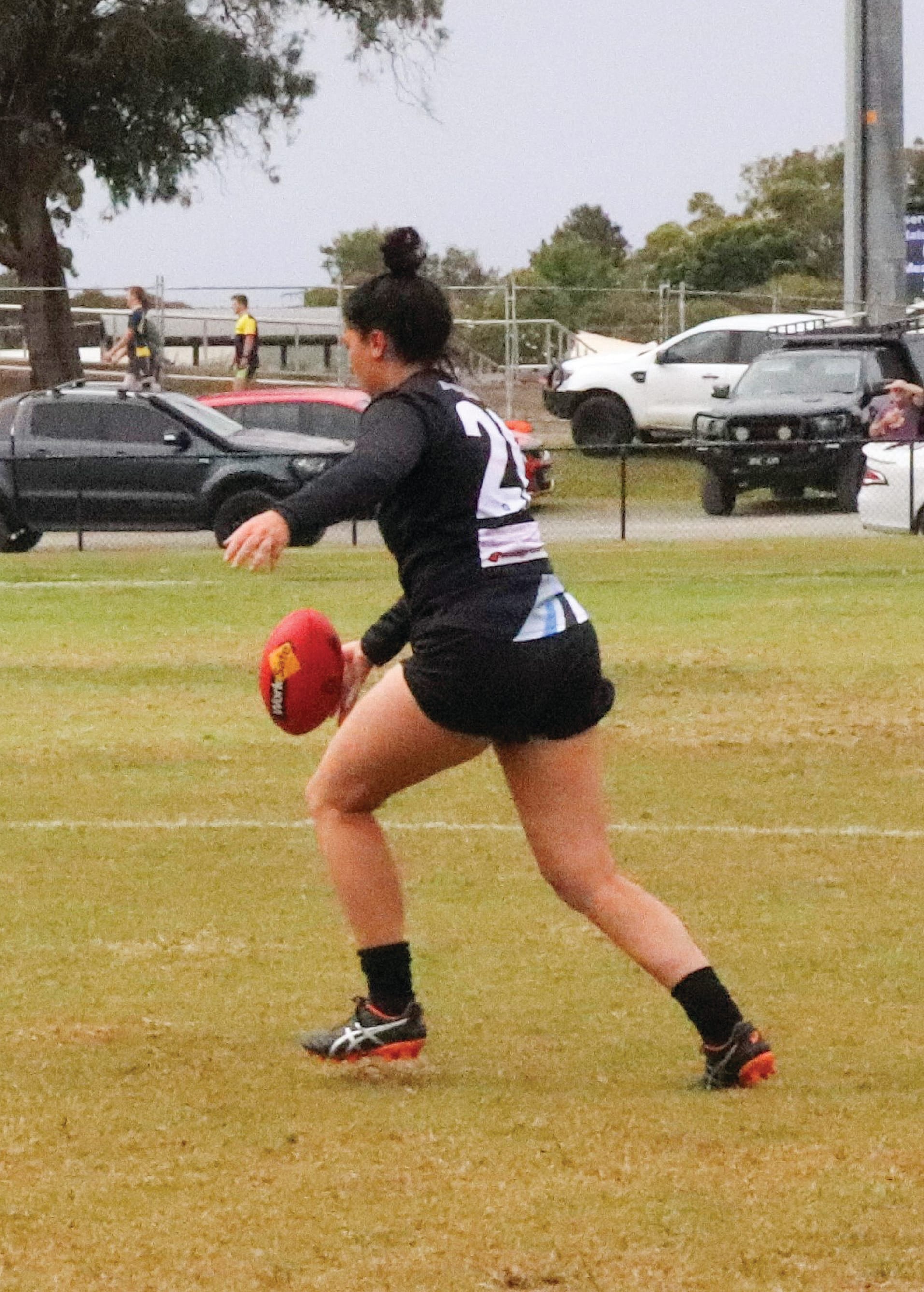 Tess Angarane clears the ball out of the centre.